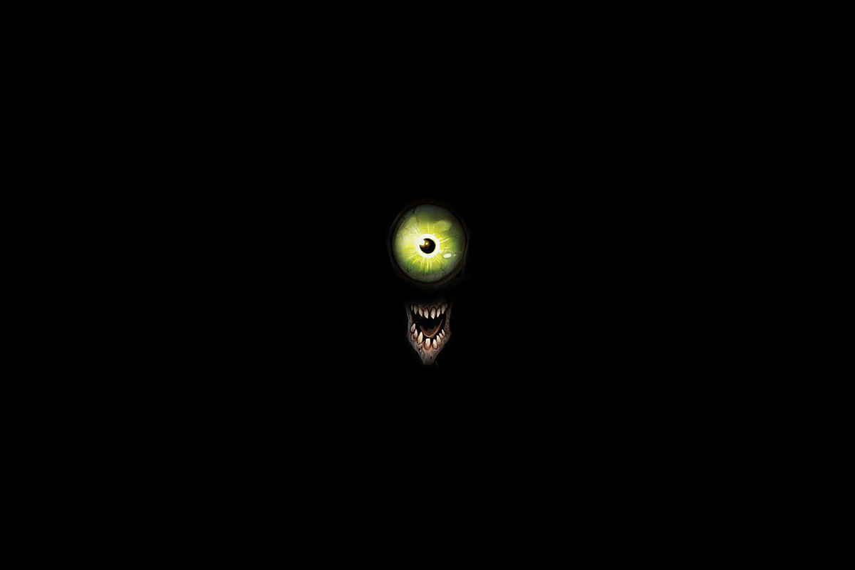 A large green eye and gaping maw in blackness.