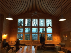 A lodge of bronze and wood overlooking the Misty Forest.